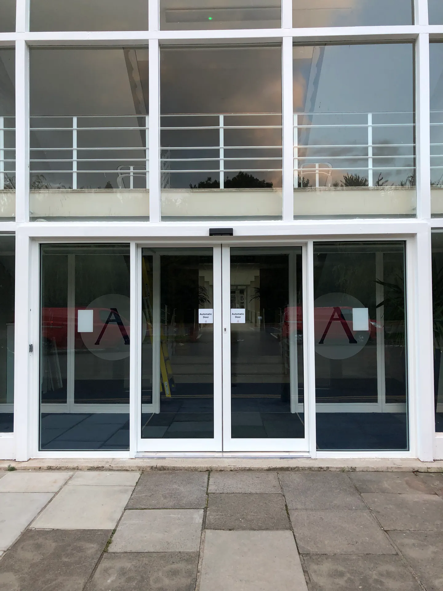 Automatic sliding entrance doors below a glazed facade